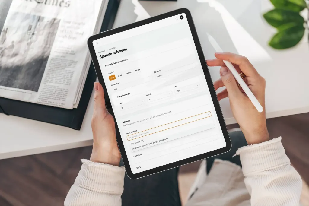 FilamentPHP Development by Laramate GmbH, in Bonn. Filament admin dashboard. Tablet displaying a donation recording form with donor personal information and address fields.
