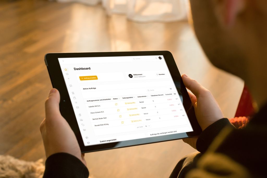 Tablet displaying a safety training e-learning platform dashboard with active assignments.