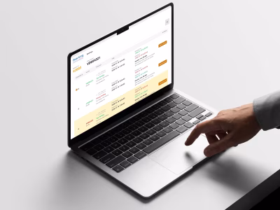Laptop showing a Pparking dashboard with vehicle bookings and license plate tracking