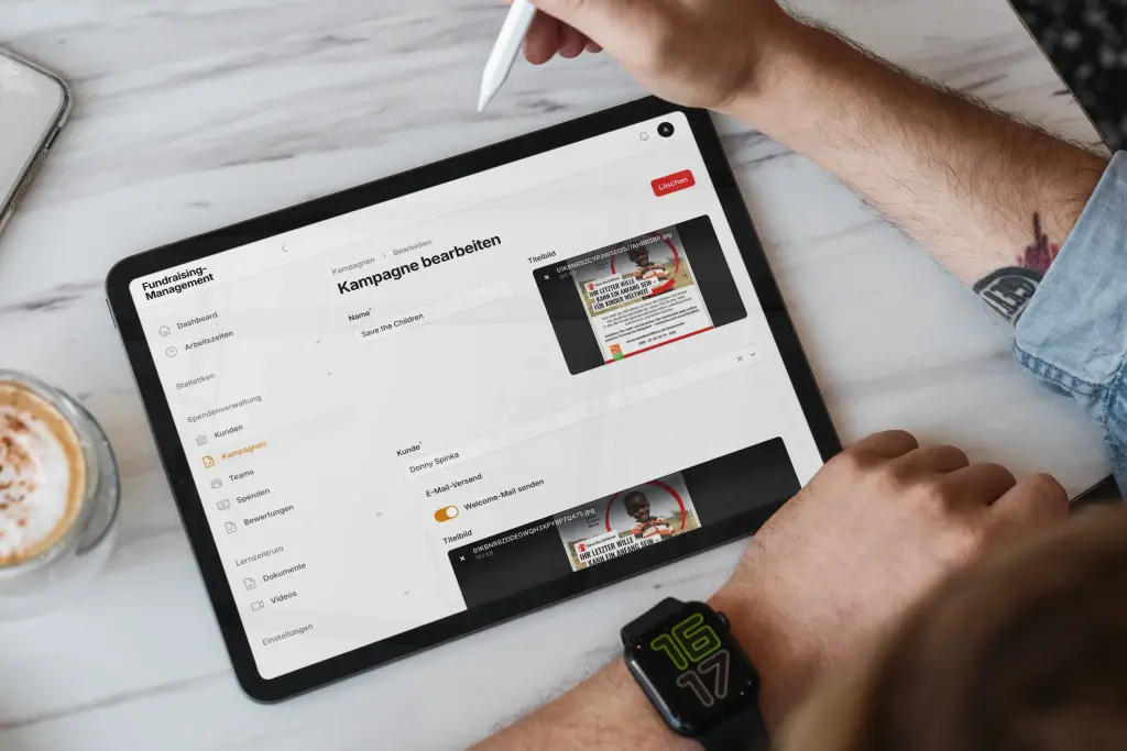Tablet displaying a fundraising campaign management interface with campaign editing tools.