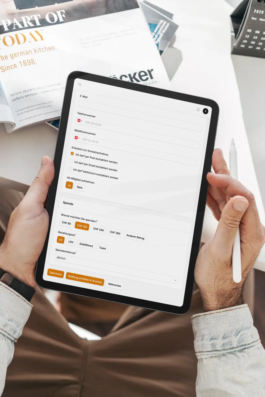 Tablet showing a donation creation form with contact details and payment options.