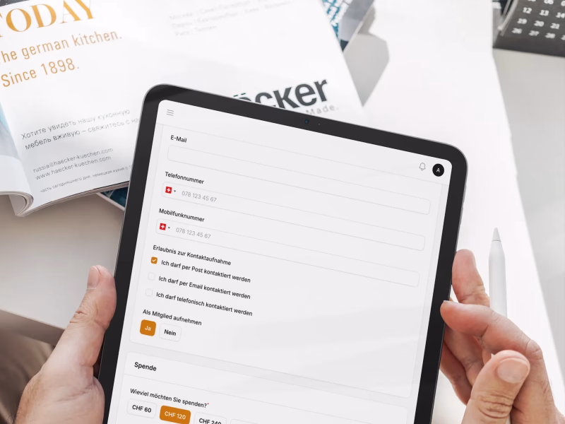 Tablet showing a donation creation form with contact details and payment options