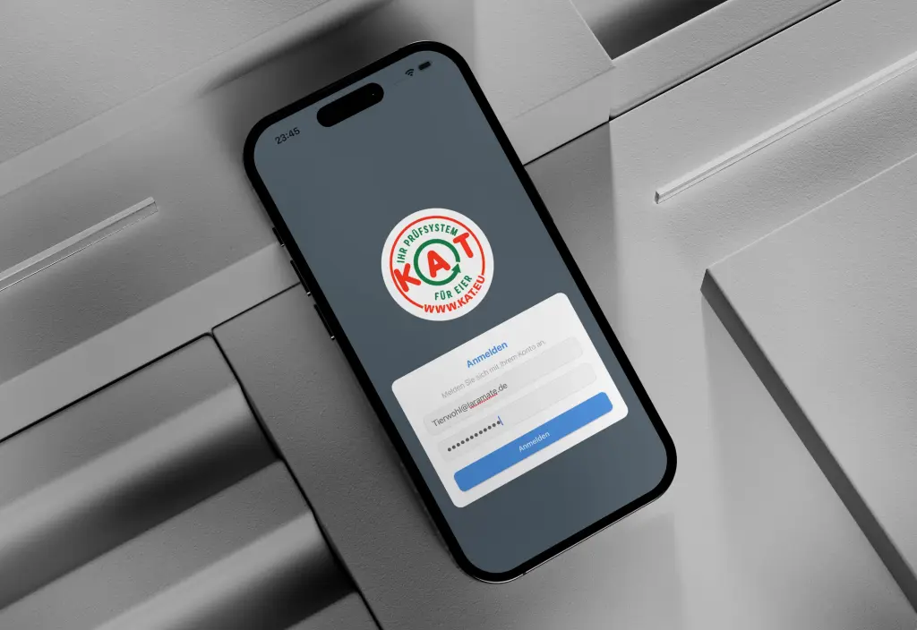 Smartphone showing a KAT certification app login screen for quality assurance. Custom app, end-to-end mobile app development built by Laramate GmbH in the poultry industry.