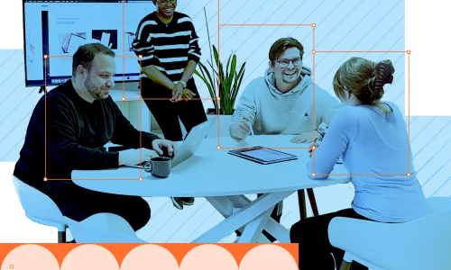 Laramate team collaborating at a meeting table in the office