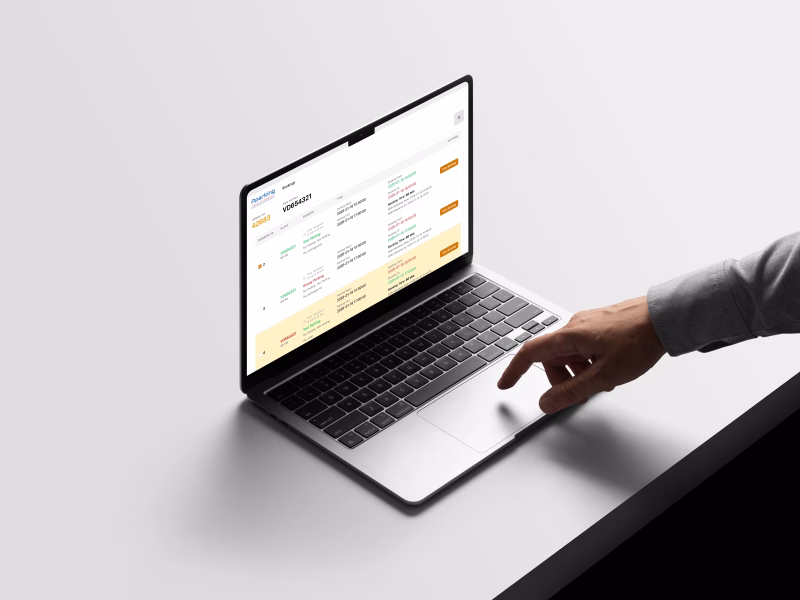 Laptop showing a Pparking dashboard with vehicle bookings and license plate tracking