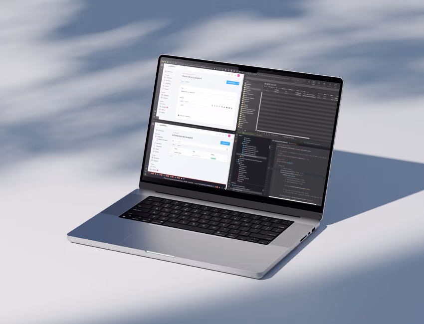 Laptop showing Statamic multi-tenant CMS setup with code editor and content management panels