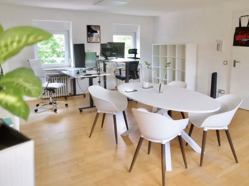 Laramate agency office with workstations and a meeting table